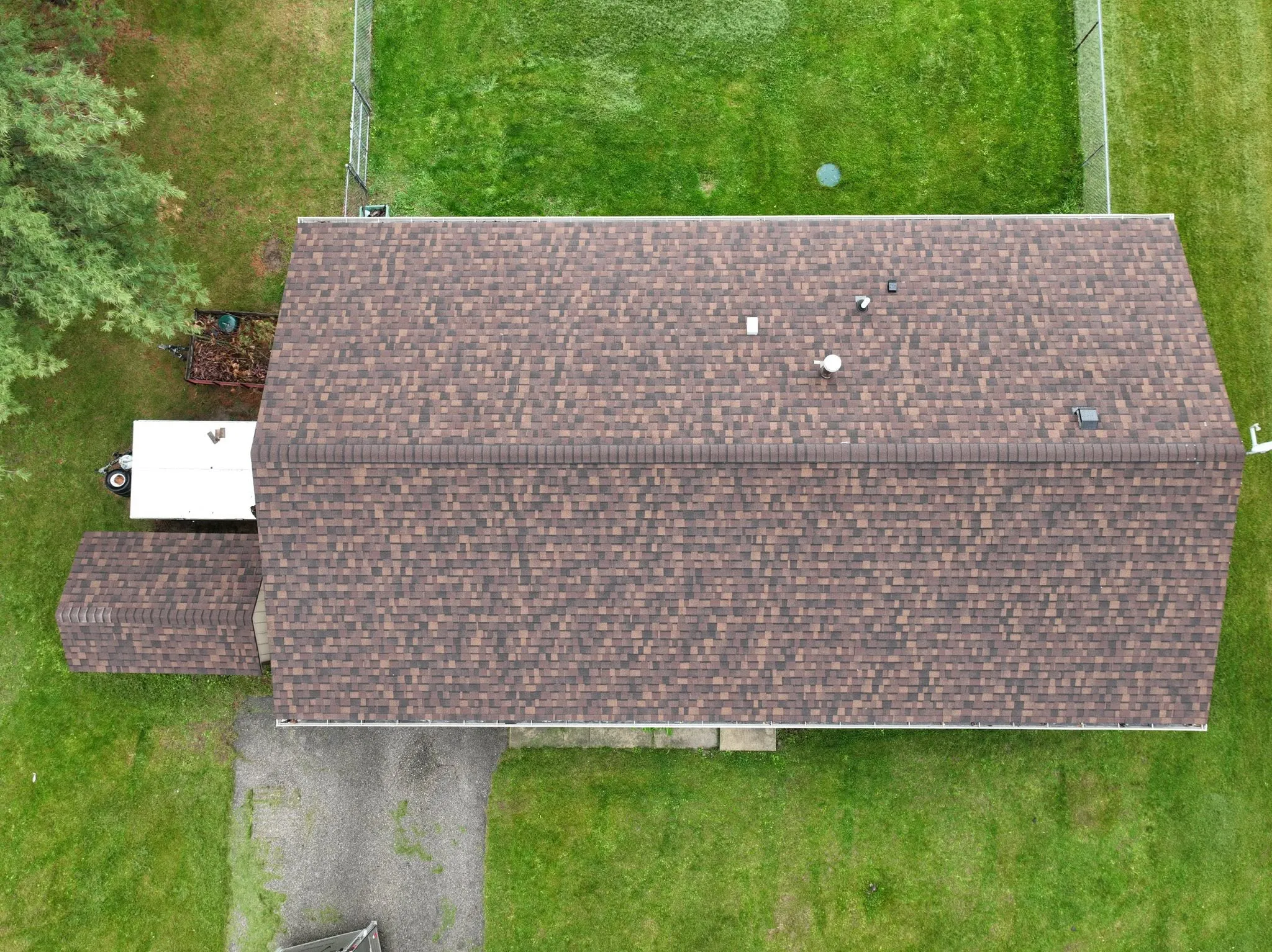Straight-down view of the new roof, showing the brown and tan blend of the Brownwood shingles