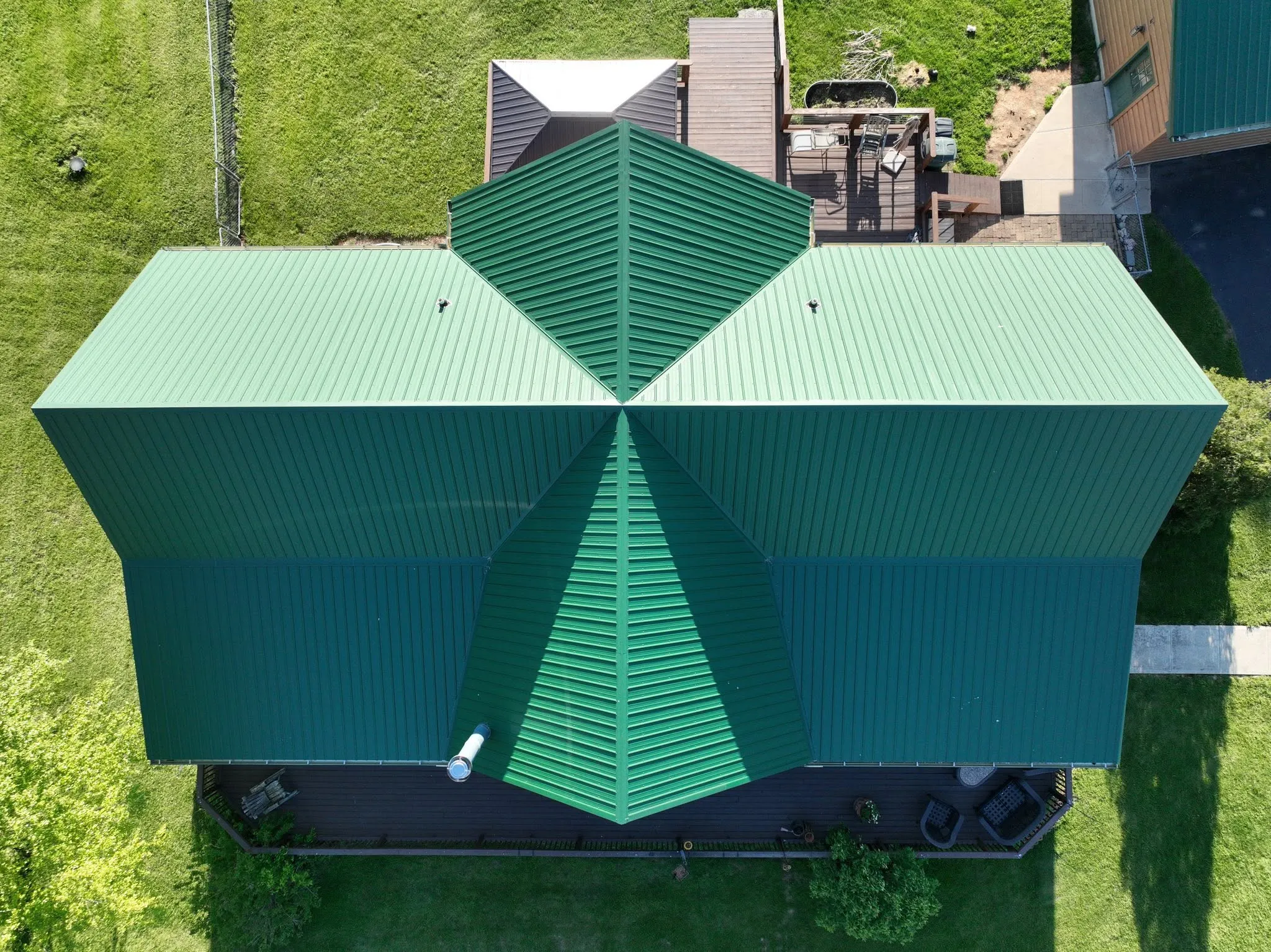 Straight-down view of the roof, showing the valleys where the center gable and the deck roof meet the main run