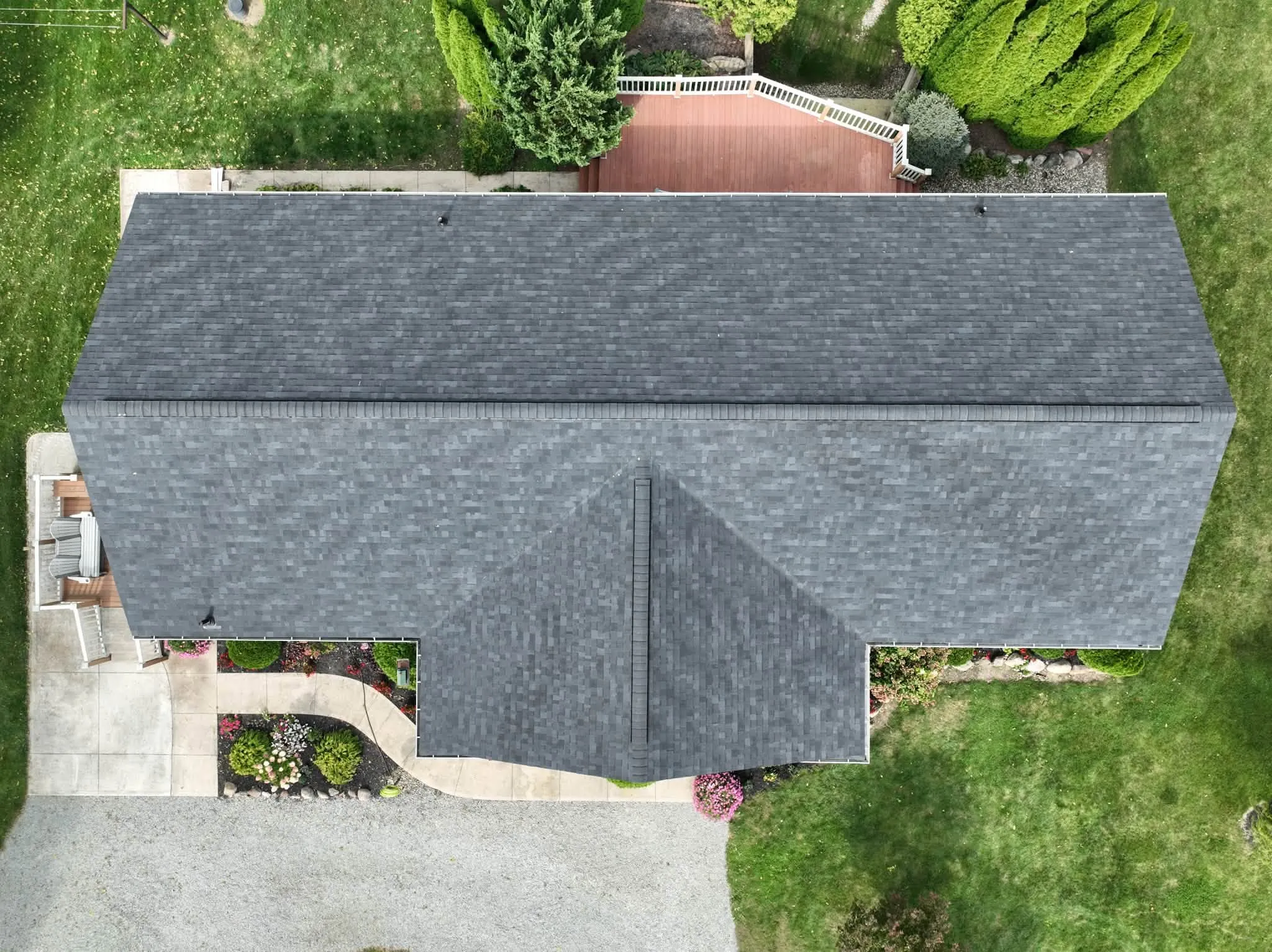 Straight-down view of the new roof, with the porch gable on the front and the deck at the back