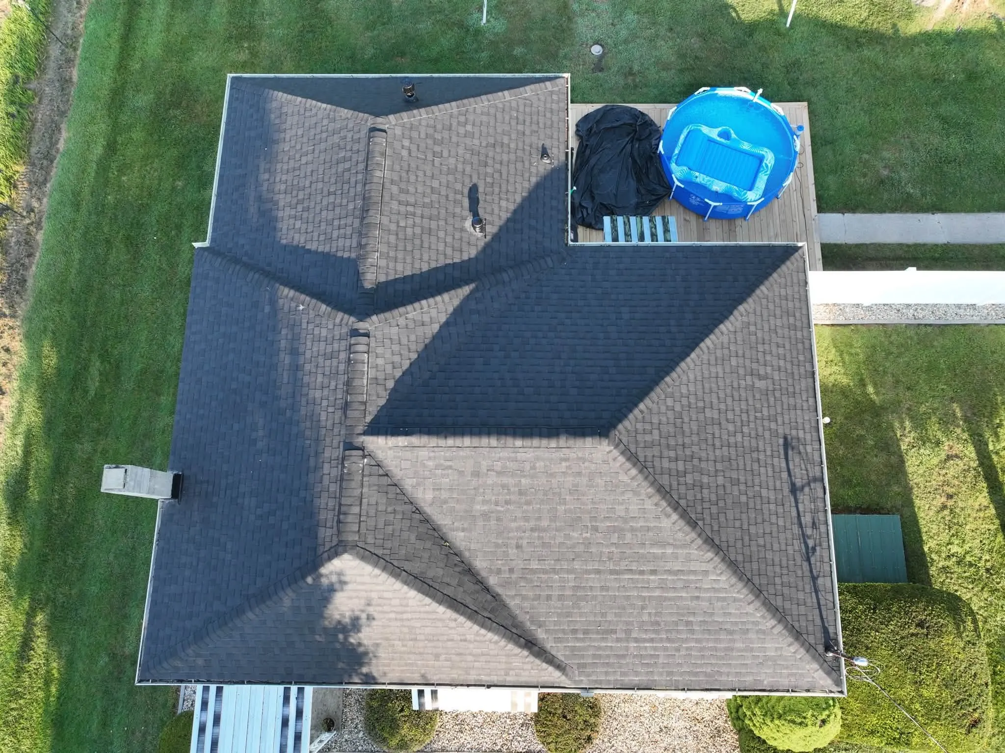 Straight-down view of the new roof, with its hips meeting at the peaks