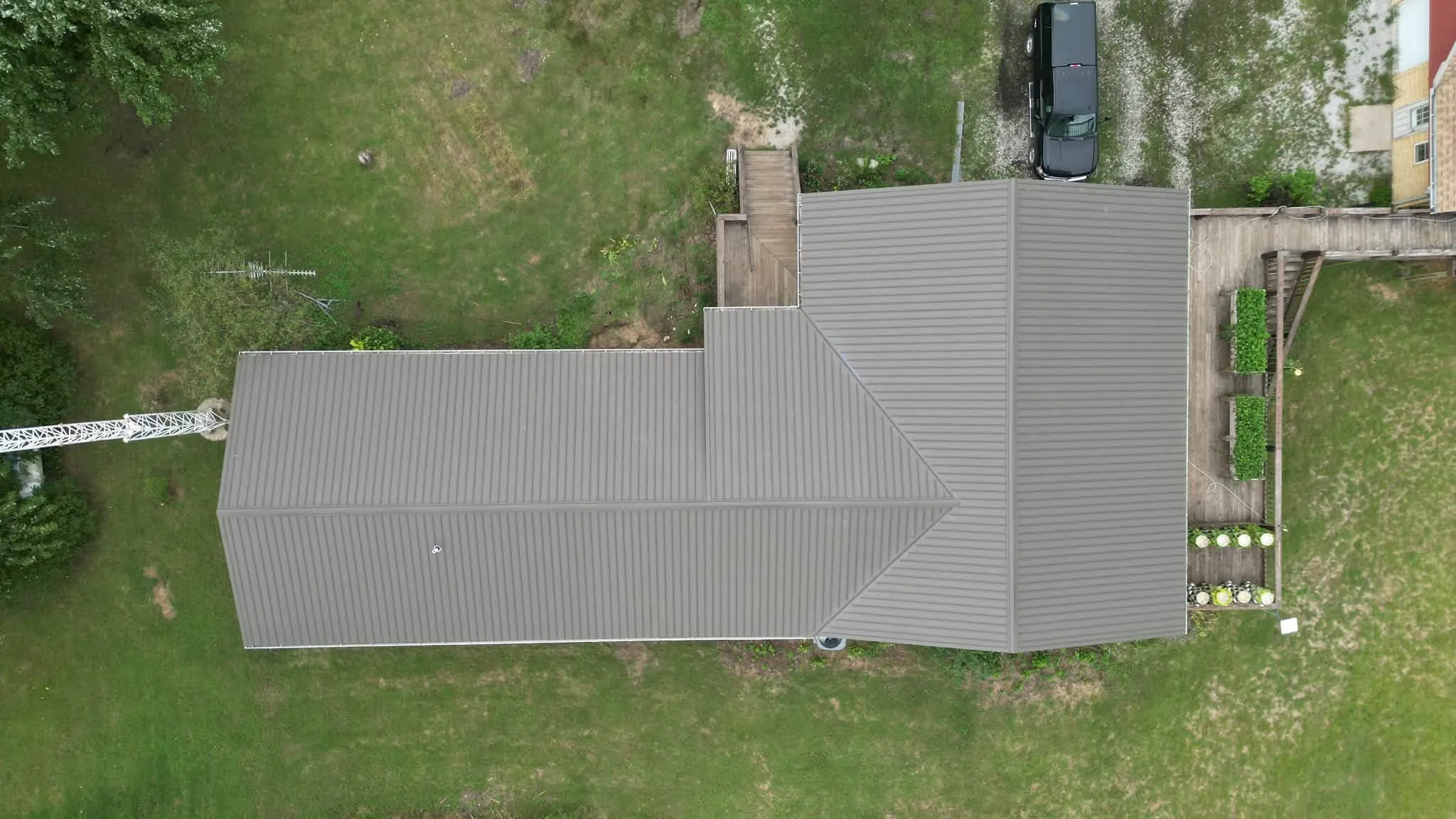 Straight-down view of the roof, with the gable section meeting the main run at the hips