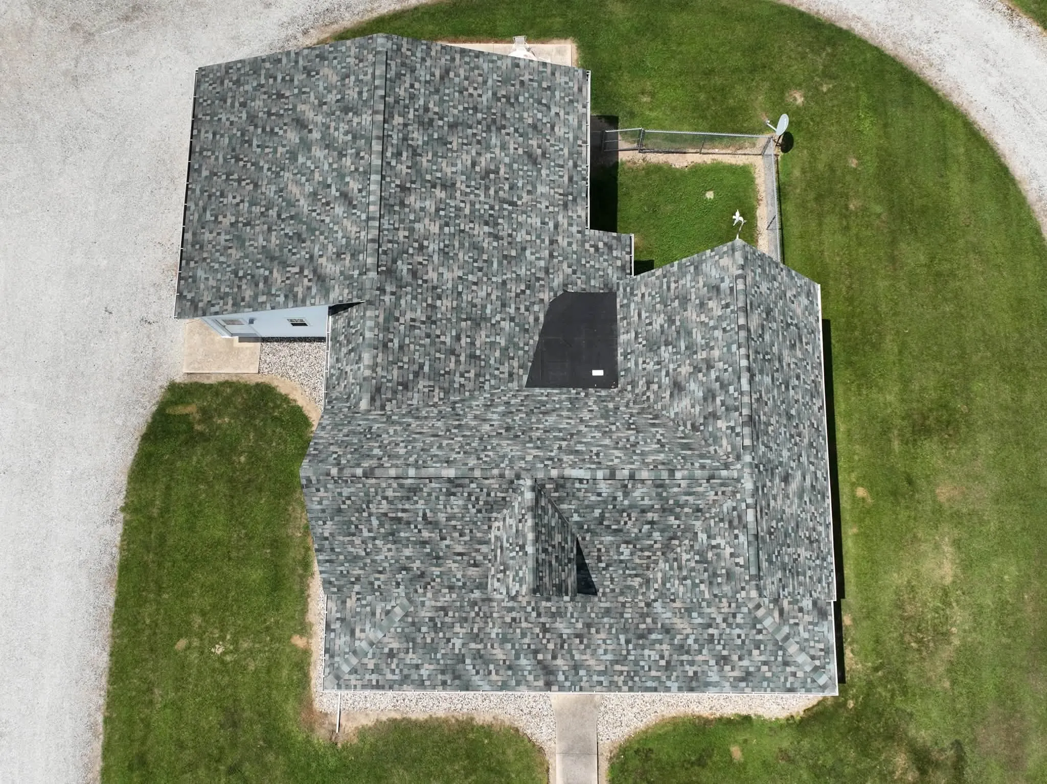 Straight-down view of the completed roof, showing the dormers and the valleys where the wings meet the main run