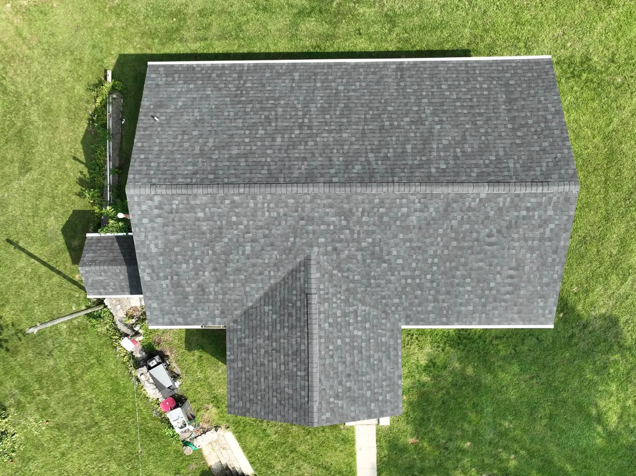 Straight-down view of the new shingle roof, with the addition's roof tying into the main roof