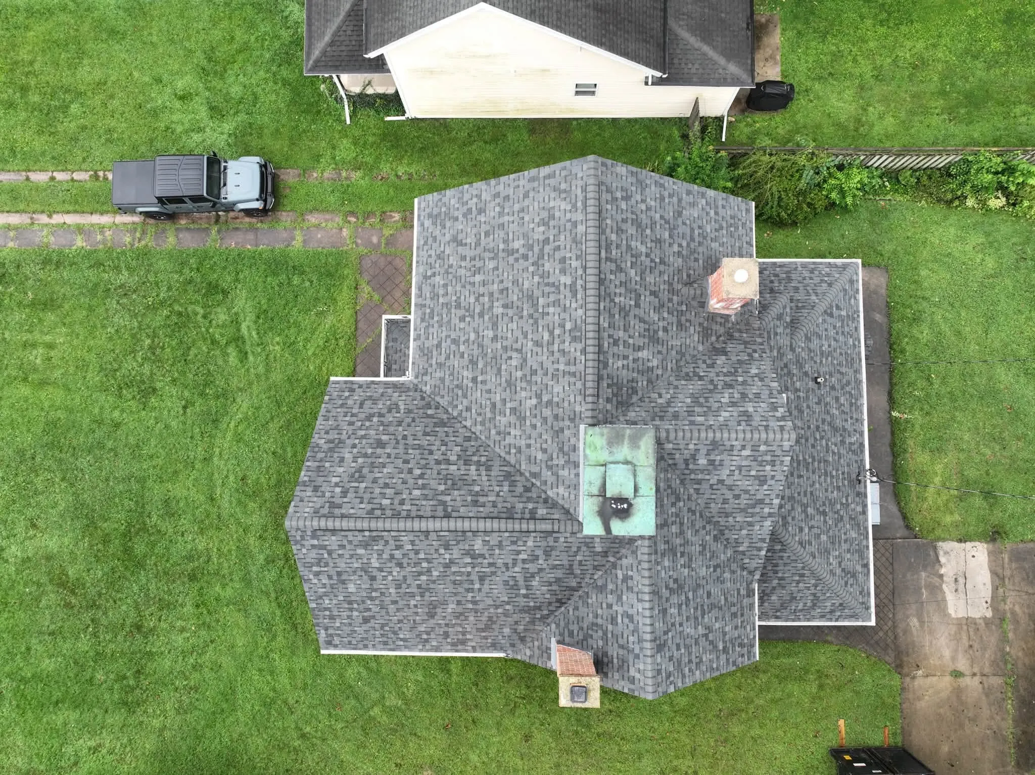 Straight-down view of the whole roof, with its hips and valleys around the chimneys
